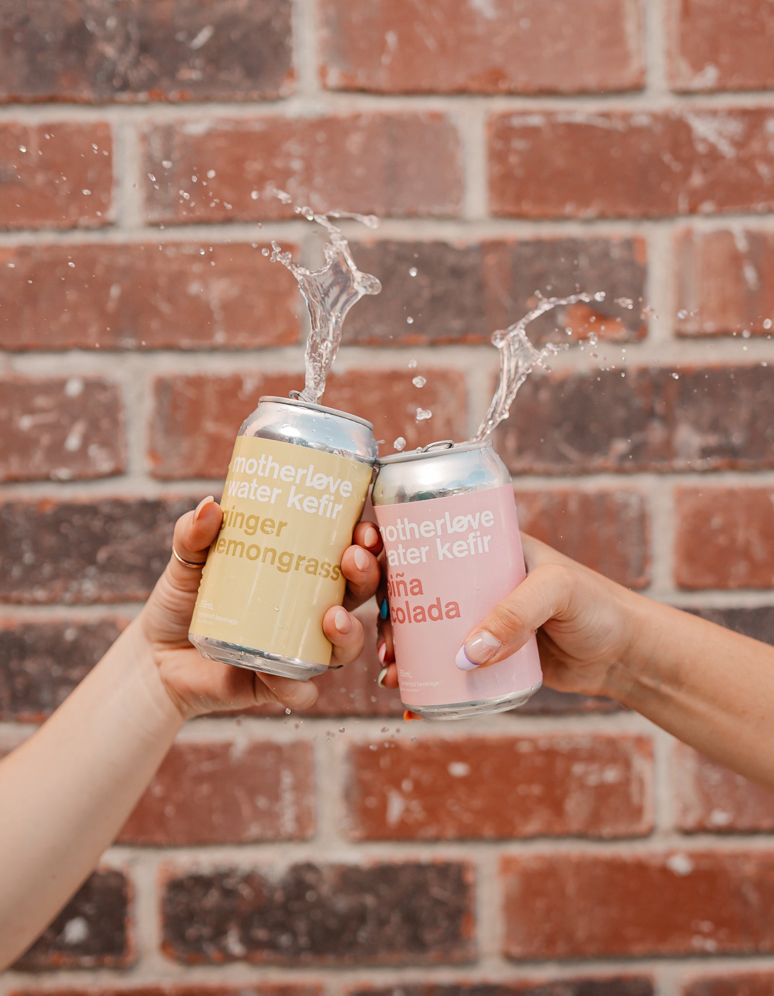 Motherlove ferments ginger lemongrass and pina colada water kefir cans cheersing